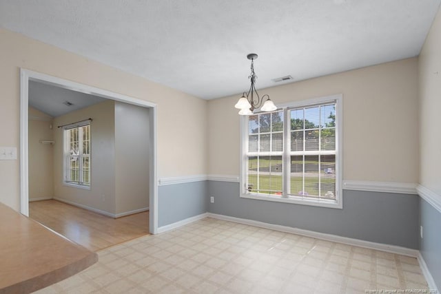 122 Van Buren Dr, Raeford, NC 28376 - spare room with a chandelier, light flooring, and baseboards