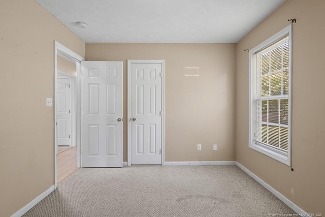 122 Van Buren Dr, Raeford, NC 28376 - unfurnished bedroom featuring baseboards, carpet, and a closet