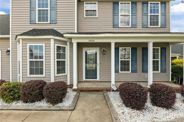 4404 Bunkers Bay Ln, Parkton, NC 28371 - entrance to property featuring covered porch and a shingled roof