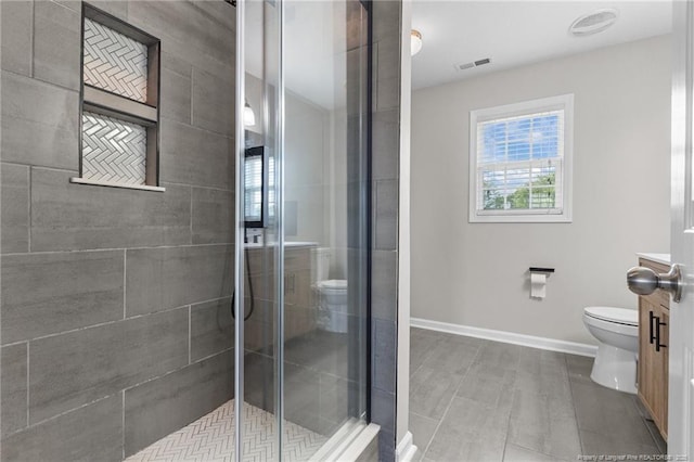 4404 Bunkers Bay Ln, Parkton, NC 28371 - bathroom with toilet, a shower stall, and baseboards
