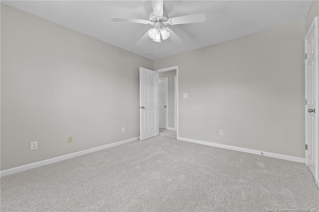 4404 Bunkers Bay Ln, Parkton, NC 28371 - unfurnished bedroom featuring light carpet, baseboards, and a ceiling fan