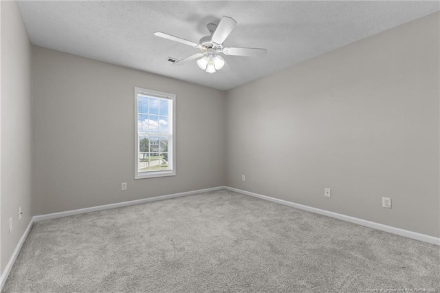 4404 Bunkers Bay Ln, Parkton, NC 28371 - unfurnished room with carpet flooring, baseboards, ceiling fan, and a textured ceiling