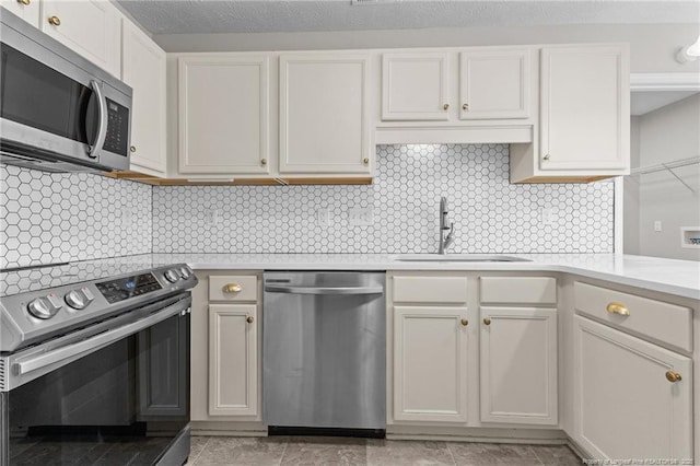 4404 Bunkers Bay Ln, Parkton, NC 28371 - kitchen with appliances with stainless steel finishes, a sink, light countertops, and tasteful backsplash