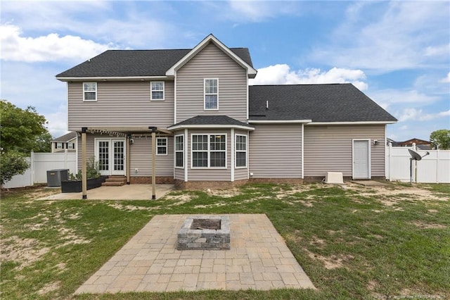 4404 Bunkers Bay Ln, Parkton, NC 28371 - rear view of house featuring a patio, an outdoor fire pit, central air condition unit, entry steps, and a shingled roof
