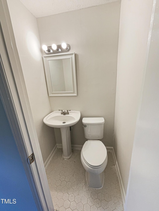 1413 Chamblee Rd, Zebulon, NC 27597 - bathroom with toilet and tile patterned flooring