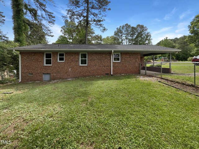 1413 Chamblee Rd, Zebulon, NC 27597 - rear view of property with crawl space, a carport, and brick siding
