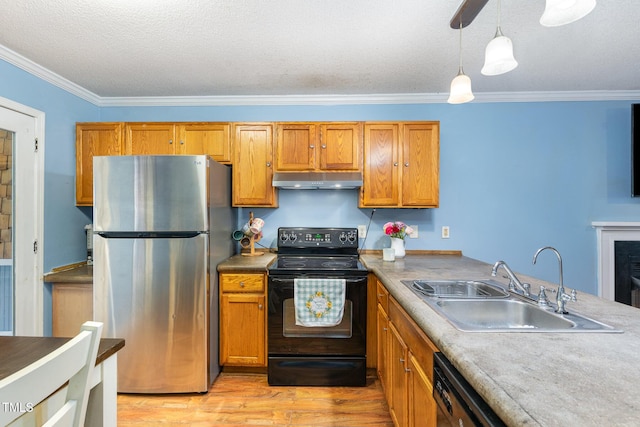 4575 Wendell Blvd, Wendell, NC 27591 - kitchen featuring freestanding refrigerator, black electric range oven, a sink, under cabinet range hood, and light wood finished floors