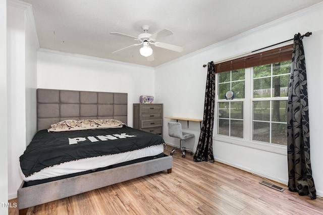 4575 Wendell Blvd, Wendell, NC 27591 - bedroom featuring crown molding, wood finished floors, baseboards, and a ceiling fan