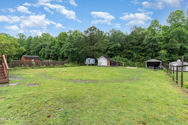 4575 Wendell Blvd, Wendell, NC 27591 - view of yard featuring a carport and stairs