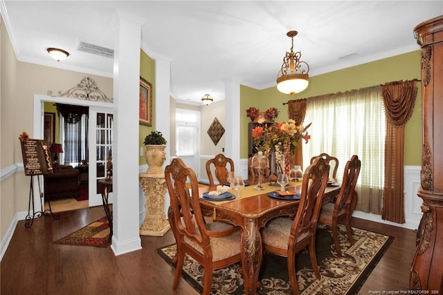 89 Revolutionary Rd, Cameron, NC 28326 - dining area featuring plenty of natural light, dark wood-style flooring, ornamental molding, wainscoting, and decorative columns