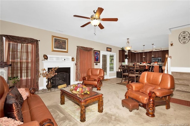 89 Revolutionary Rd, Cameron, NC 28326 - living area with ceiling fan, light colored carpet, a fireplace with flush hearth, and baseboards