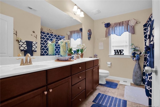 89 Revolutionary Rd, Cameron, NC 28326 - full bath featuring double vanity, toilet, baseboards, and tile patterned flooring