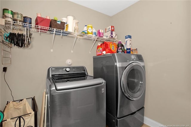 89 Revolutionary Rd, Cameron, NC 28326 - laundry area featuring washing machine and dryer and baseboards