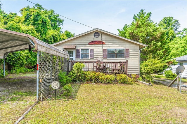 8212 Main St, West End, NC 27376 - view of front of house featuring a carport and a front yard