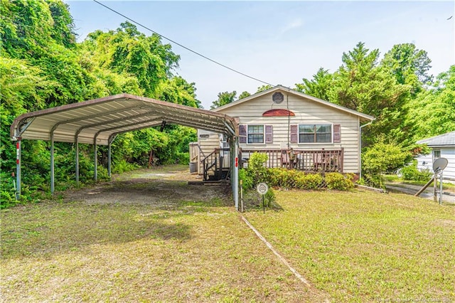 8212 Main St, West End, NC 27376 - view of front of house with a detached carport, a front yard, and driveway