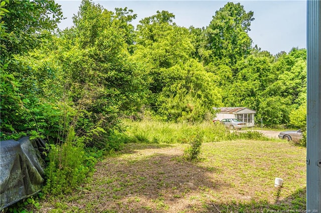 8212 Main St, West End, NC 27376 - view of yard with a forest view