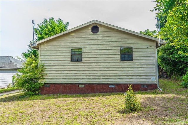 8212 Main St, West End, NC 27376 - view of home's exterior with crawl space and a lawn