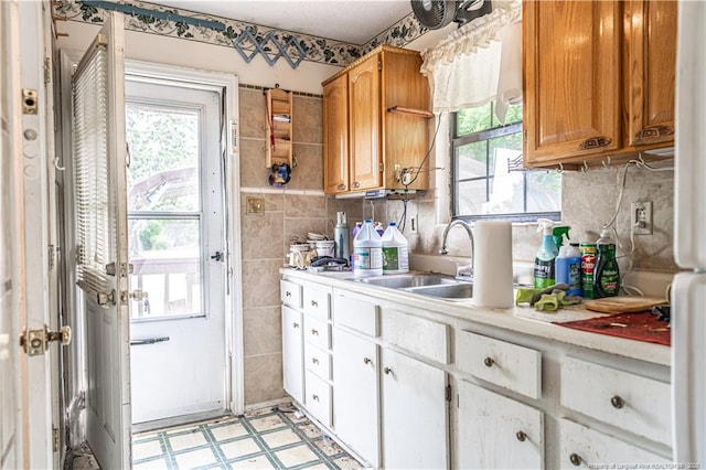 8212 Main St, West End, NC 27376 - kitchen featuring light countertops, a sink, plenty of natural light, and light floors