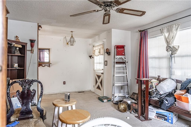 8212 Main St, West End, NC 27376 - living area featuring ceiling fan and a textured ceiling