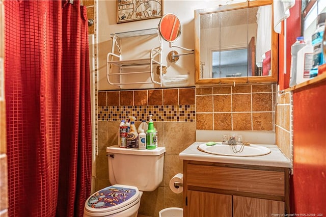 8212 Main St, West End, NC 27376 - full bathroom featuring toilet, vanity, curtained shower, and tile walls