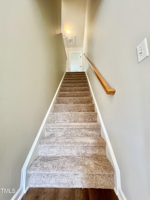 2118 Kedvale Ave, Raleigh, NC 27617 - stairs featuring baseboards and wood finished floors