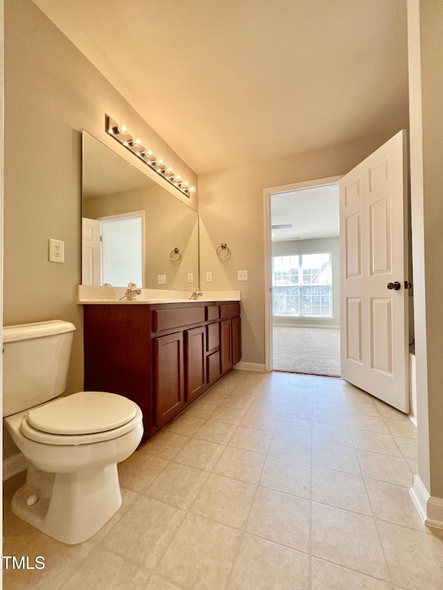 2118 Kedvale Ave, Raleigh, NC 27617 - bathroom featuring vanity, toilet, baseboards, and tile patterned flooring