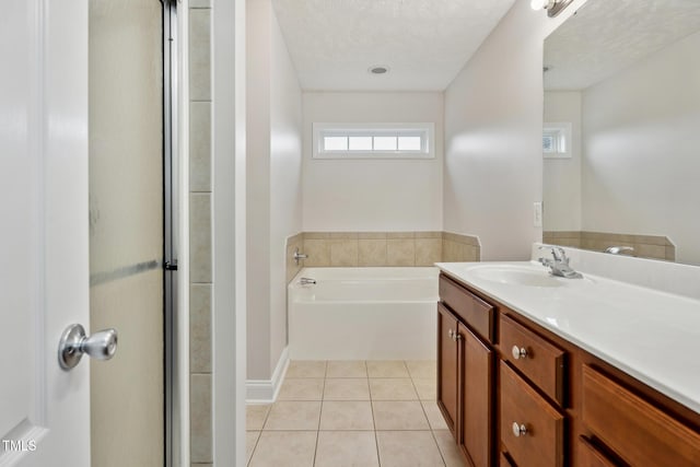 128 Newton Ct, Raeford, NC 28376 - bathroom featuring vanity, a garden tub, and tile patterned floors