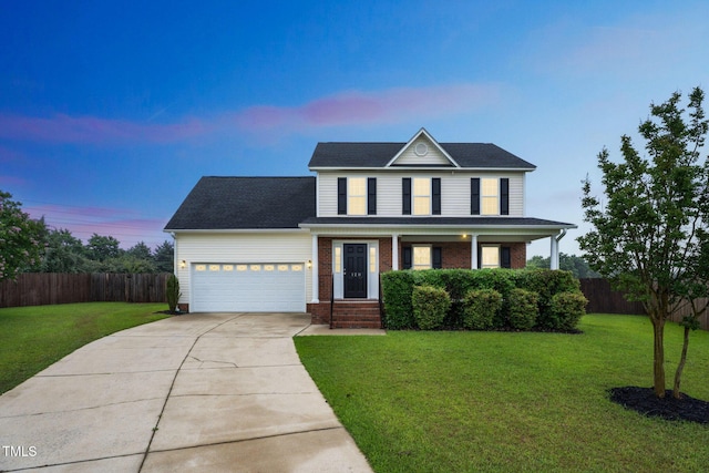 128 Newton Ct, Raeford, NC 28376 - traditional-style home featuring concrete driveway, a garage, brick siding, and a porch