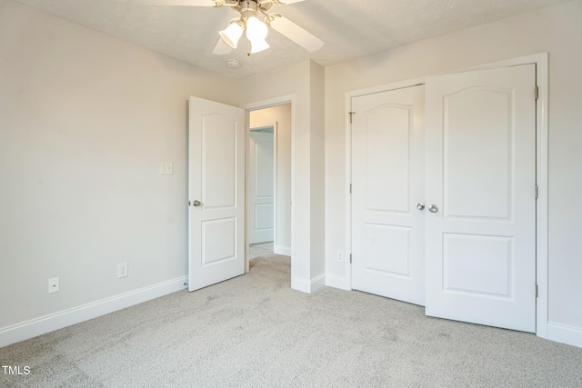 128 Newton Ct, Raeford, NC 28376 - unfurnished bedroom featuring carpet floors, baseboards, a closet, and ceiling fan