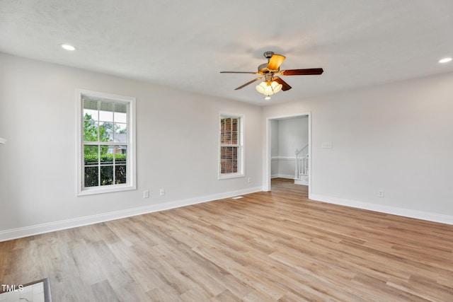 128 Newton Ct, Raeford, NC 28376 - spare room featuring light wood finished floors, a ceiling fan, baseboards, and recessed lighting