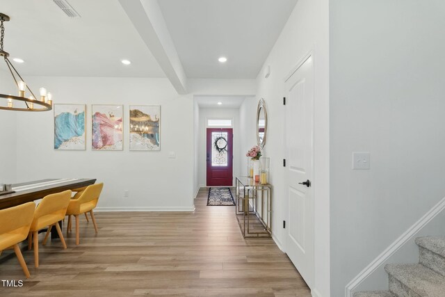 187 Harpers Landing Rd, Garner, NC 27529 - foyer entrance featuring light wood-style flooring, a chandelier, baseboards, recessed lighting, and stairs