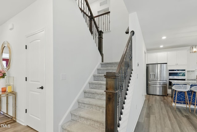187 Harpers Landing Rd, Garner, NC 27529 - staircase with wood finished floors and recessed lighting