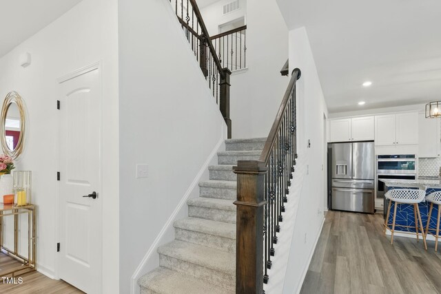 187 Harpers Landing Rd, Garner, NC 27529 - staircase with wood finished floors and recessed lighting