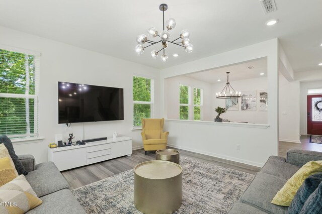 187 Harpers Landing Rd, Garner, NC 27529 - living area featuring a chandelier, wood finished floors, recessed lighting, and baseboards