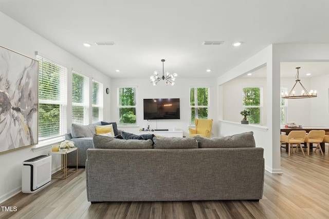 187 Harpers Landing Rd, Garner, NC 27529 - living area with a chandelier, wood finished floors, recessed lighting, and baseboards