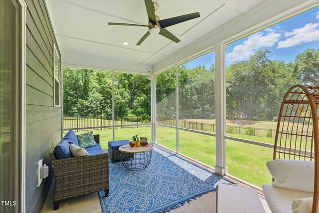 187 Harpers Landing Rd, Garner, NC 27529 - sunroom / solarium featuring a ceiling fan, view of wooded area, and plenty of natural light