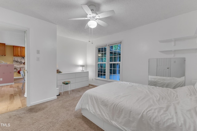 4009 Olde Coach Rd, Durham, NC 27707 - bedroom with a textured ceiling, light colored carpet, baseboards, and ceiling fan