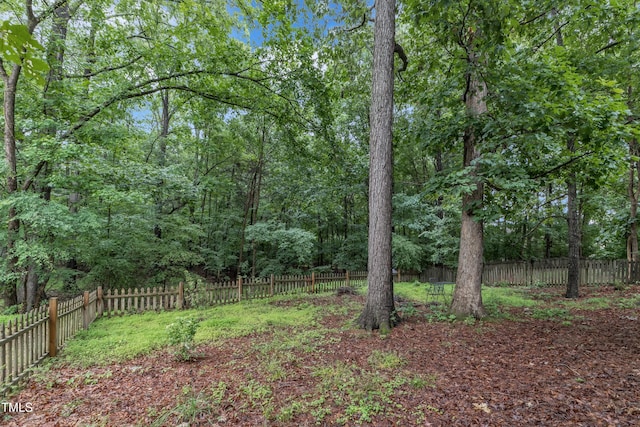 4009 Olde Coach Rd, Durham, NC 27707 - fenced backyard with a wooded view