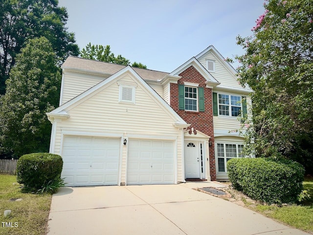 107 Woolard Way, Apex, NC 27502 - traditional-style house featuring concrete driveway, an attached garage, and brick siding