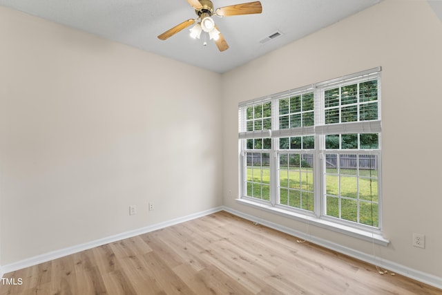 107 Woolard Way, Apex, NC 27502 - unfurnished room with light wood-style flooring, baseboards, and a ceiling fan