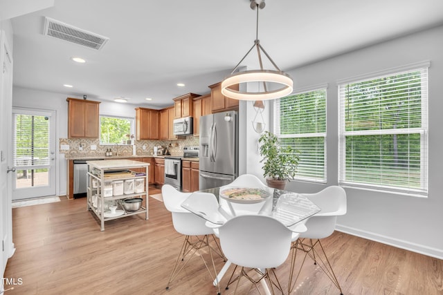 537 Hobkirks Pl, Durham, NC 27704 - dining space featuring light wood finished floors, recessed lighting, and baseboards