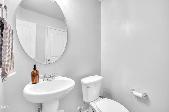 537 Hobkirks Pl, Durham, NC 27704 - half bathroom with toilet and a sink