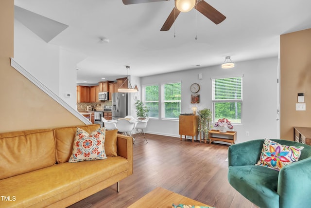 537 Hobkirks Pl, Durham, NC 27704 - living room with wood finished floors, ceiling fan, and baseboards