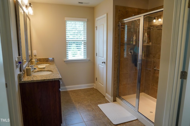 825 Fulworth Ave, Wake Forest, NC 27587 - bathroom featuring double vanity, a stall shower, and tile patterned floors