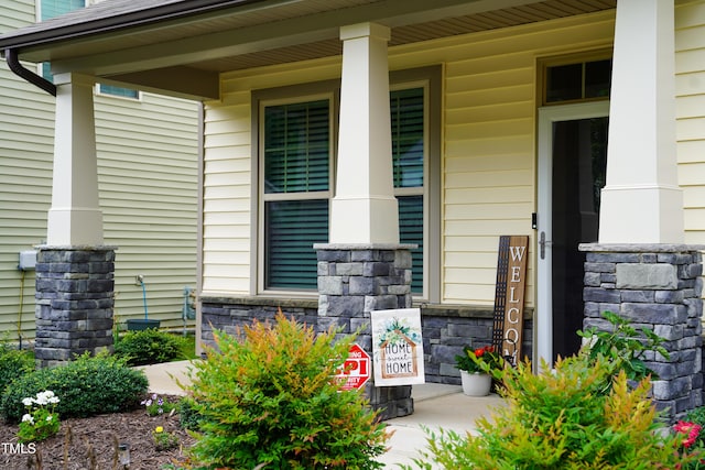 825 Fulworth Ave, Wake Forest, NC 27587 - doorway to property with a porch and stone siding