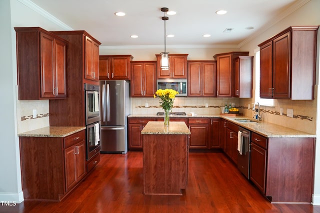 825 Fulworth Ave, Wake Forest, NC 27587 - kitchen featuring appliances with stainless steel finishes, a kitchen island, light stone countertops, pendant lighting, and recessed lighting