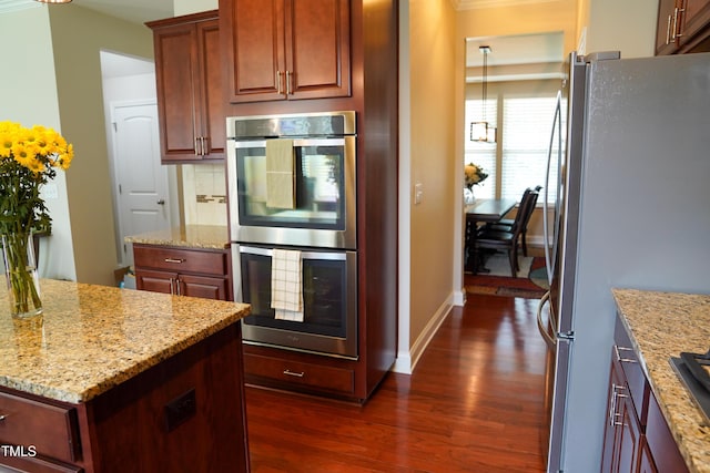 825 Fulworth Ave, Wake Forest, NC 27587 - kitchen with appliances with stainless steel finishes, dark wood-style flooring, light stone countertops, and decorative backsplash