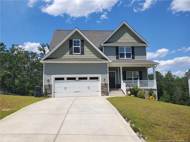 112 Nairn St, Fayetteville, NC 28311 - craftsman house featuring a porch, driveway, a front yard, and a garage