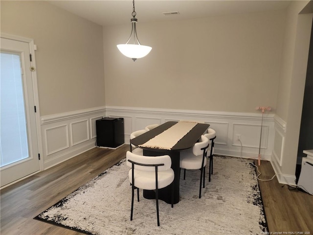 112 Nairn St, Fayetteville, NC 28311 - dining area featuring wood finished floors, wainscoting, and a decorative wall