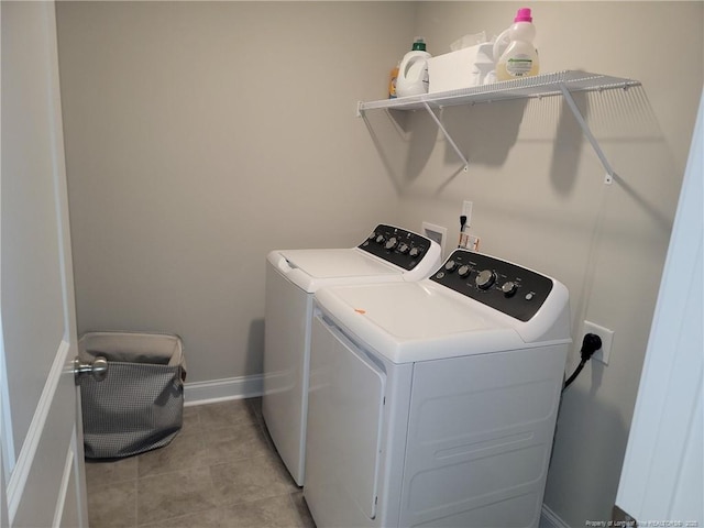 112 Nairn St, Fayetteville, NC 28311 - laundry area featuring washer and clothes dryer, light tile patterned floors, and baseboards
